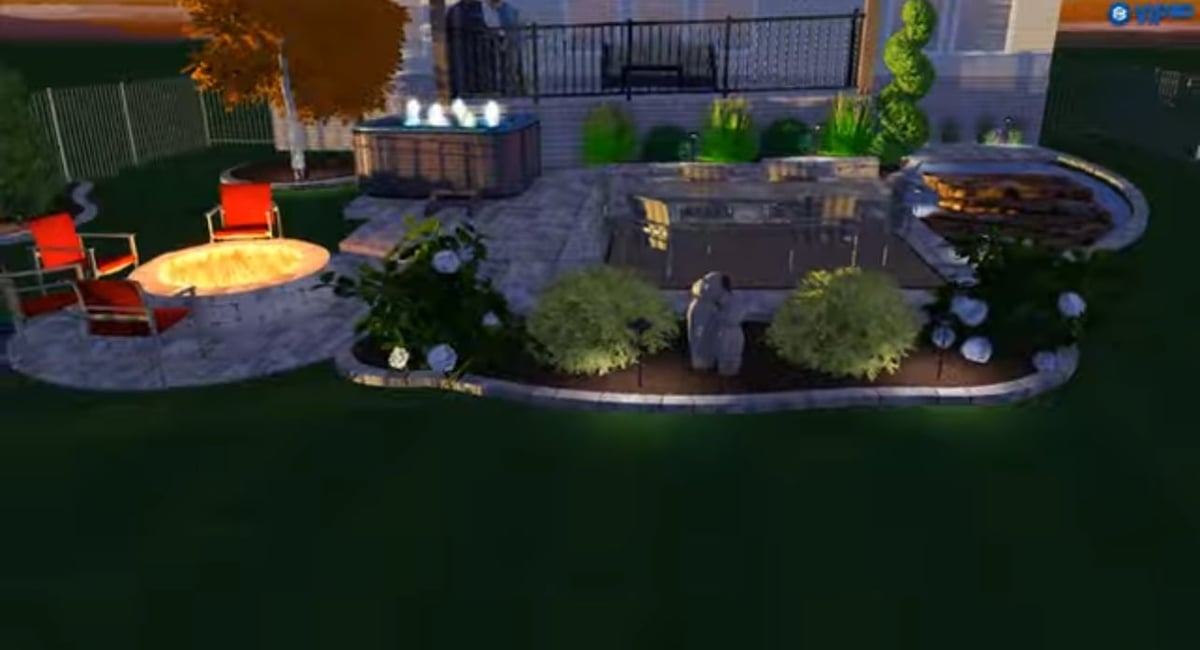 Aerial view of a modern backyard landscape design with circular seating areas, fire pit, curved stone pathways, green lawn, and decorative plants.